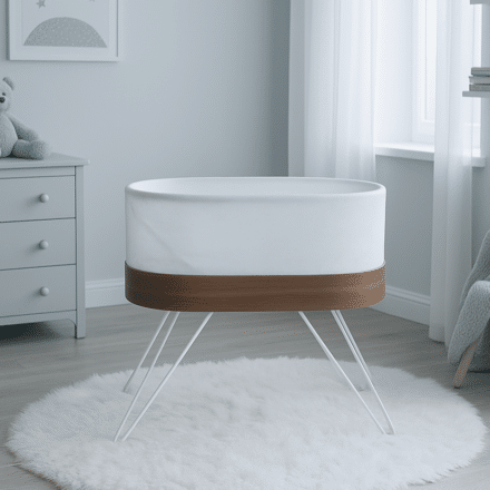 Snoo bassinet in a softly lit nursery with wooden trim and white mesh sides