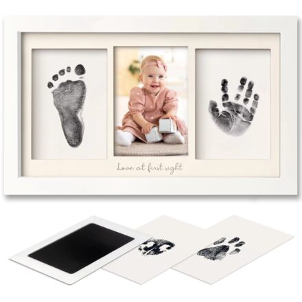 Flat-lay image of a baby footprint ink kit with printed canvas keepsake